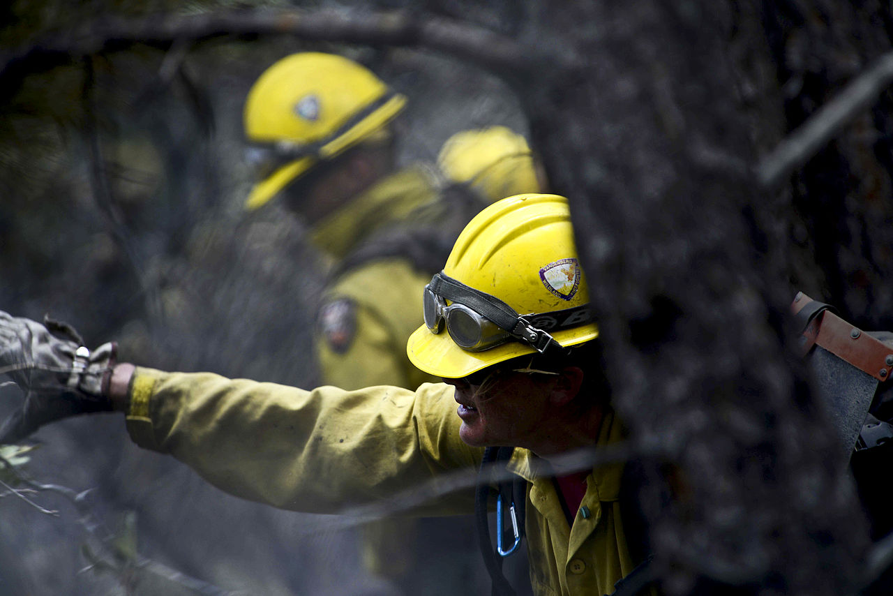 Picture of Vandenberg Air Force Base Hot Shot fire fighter Marissa Halbeisen cutting and clearing a fire line on June 28, 2012 in the Mount Saint Francois area of Colorado Springs.