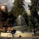 Students walk and cycle past the centerpiece fountain at Fresno State