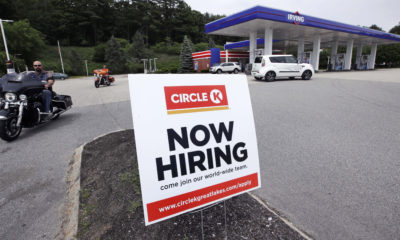 Photo of a "Now Hiring" sign