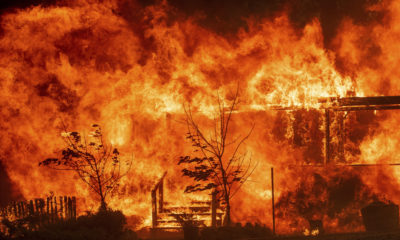 Photo of the River Fire consuming a home