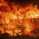 Photo of the River Fire consuming a home