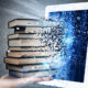 Photo Illustration of a pile of books being absorbed by a laptop
