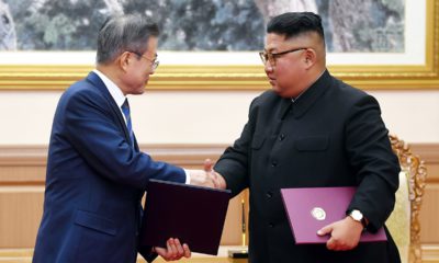 Photo of Kim Jong Un and Moon Jae-in shaking hands