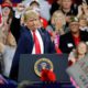 Photo of President Donald Trump acknowledges a crowd at a rally