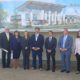 Photo of Fresno area politicians in front of architect's rendering of the "Urban Academy"