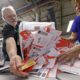 Photo of election workers dumping ballots collected from drop boxes
