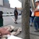 Photo of a man sleeping on the sidewalk in Seattle, WA