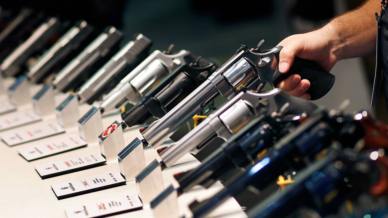 Photo of handguns displayed at the Smith & Wesson booth at the Shooting, Hunting and Outdoor Trade Show in Las Vegas