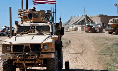 Photo of a US soldier sitting in an armored vehicle