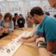 Photo of people looking at Apple Watches in New York