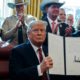 Photo of President Donald Trump after signing his first veto in the Oval Office