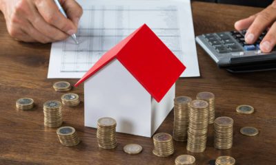 Photo of money and a tiny house