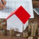 Photo of money and a tiny house
