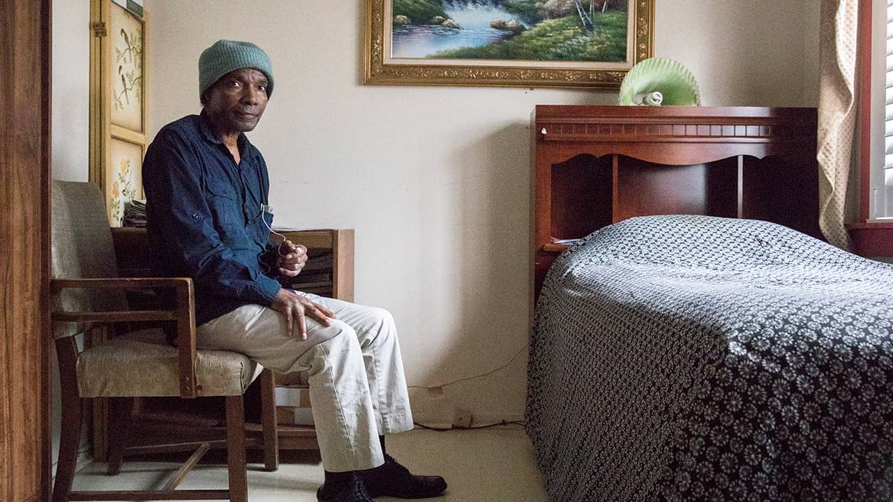 Photo of Tom Gray in his bedroom