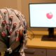 Pjhoto of a cap that administers electrical stimulation and monitors brainwaves
