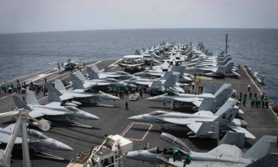 Photo of sailors partaking in a foreign object and debris walk-down
