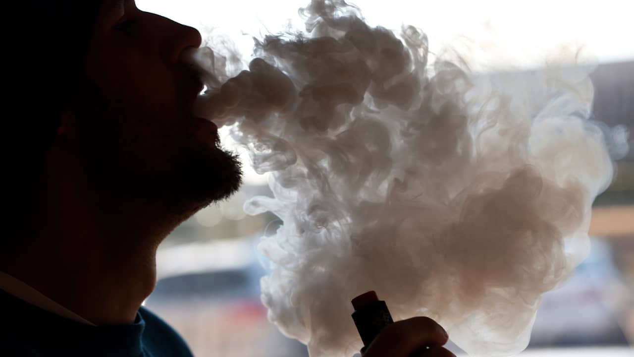 Photo of a man vaping