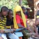 Photo of children fathering to learn from tablets