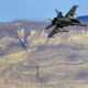Photo of a U.S. Navy F-18 Super Hornet flying out of Star Wars Canyon in Death Valley, California.