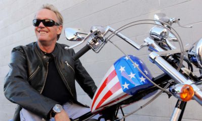 Photo of Peter Fonda on the chopper motorcycle he made famous in Easy RiderDo