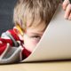 Photo of a bored student hiding his face