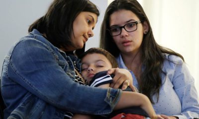 Photo of a woman holding her son