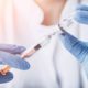 Photo of a doctor with a vaccine
