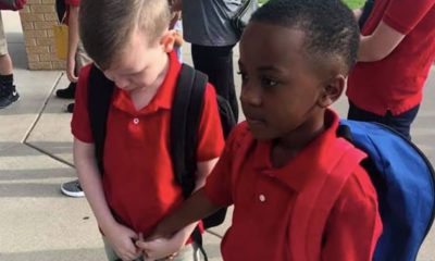 Photo of two kids holding hands