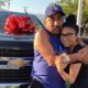 Photo of Yesenia Valencia and her dad after she surprised him with a new truck