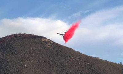 Photo of plane dropping fire retardant on the Briceburg Fire