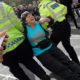Photo of police arresting a climate demonstrator