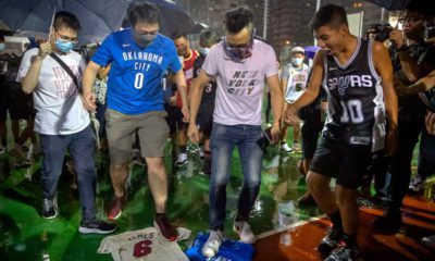 Photo of Hong Kong protestors stomping on LeBron James jerseys