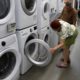 Photo of a woman examining washers