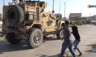 Photo of residents throwing potatoes at military vehicles