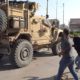 Photo of residents throwing potatoes at military vehicles