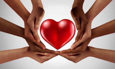 Picture of hands surrounding a heart symbolizing philanthropy