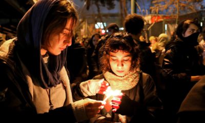 Photo of people gathering for a candlelight vigil