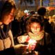 Photo of people gathering for a candlelight vigil