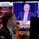 Photo of Jerome Powell on a television at the New York Stock Exchange