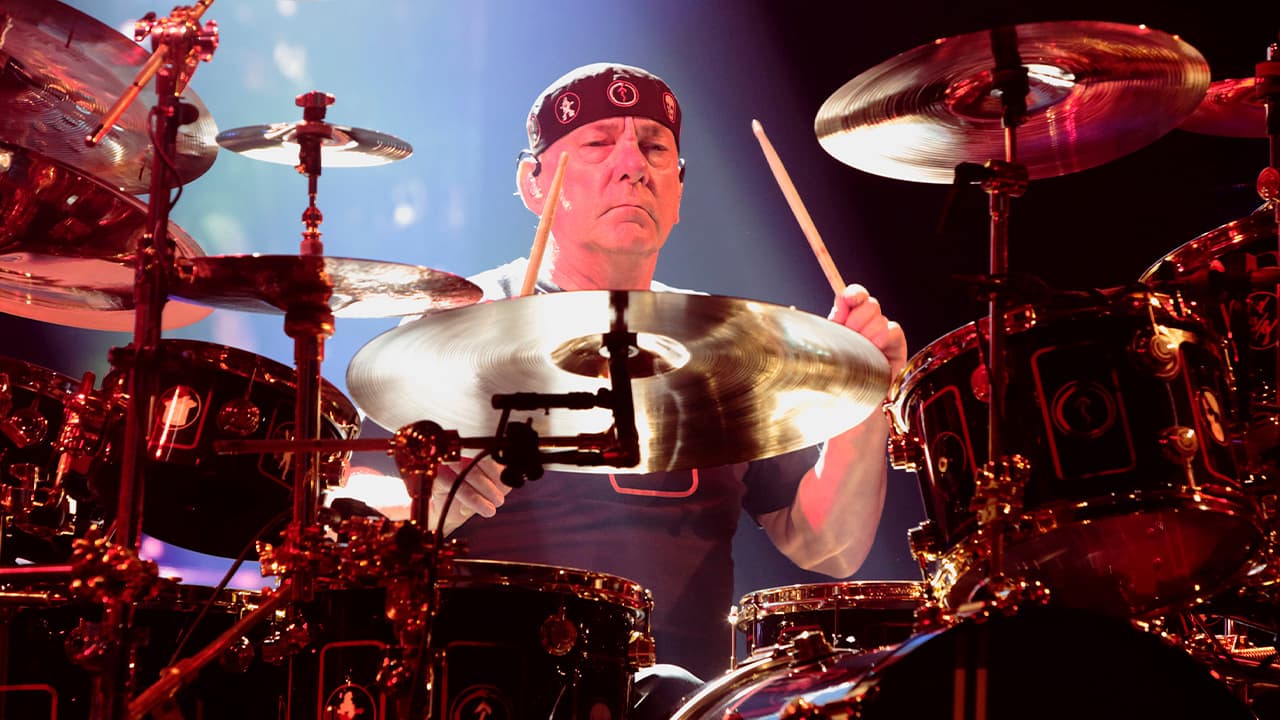 Photo of Neil Peart of the band Rush performing in concert
