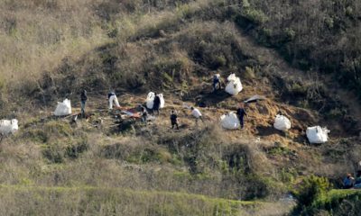 Photo of investigators working at the scene of the helicopter crash that killed Kobe Bryant