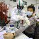 Photo of a medical staff member attends to a patient