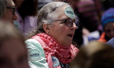 Photo of a woman with a Warren sticker on her forehead