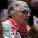 Photo of a woman with a Warren sticker on her forehead