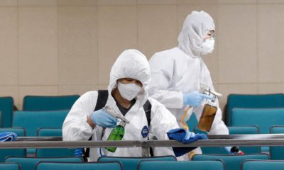 Photo of workers disinfecting a gym in South Korea