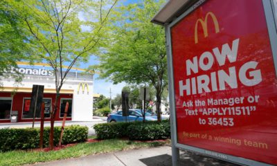 Photo of a Now Hiring sign in front of a McDonald's in Miami