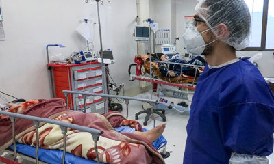 Photo of a nurse caring for a patient in Qom, Iran