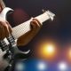 Photo of a man playing a guitar