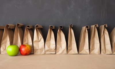 Photo of school lunches against a blackboard