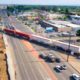 Aerial view of diagonal BNSF train crossing at Blackstone and McKinley avenues in Fresno, California